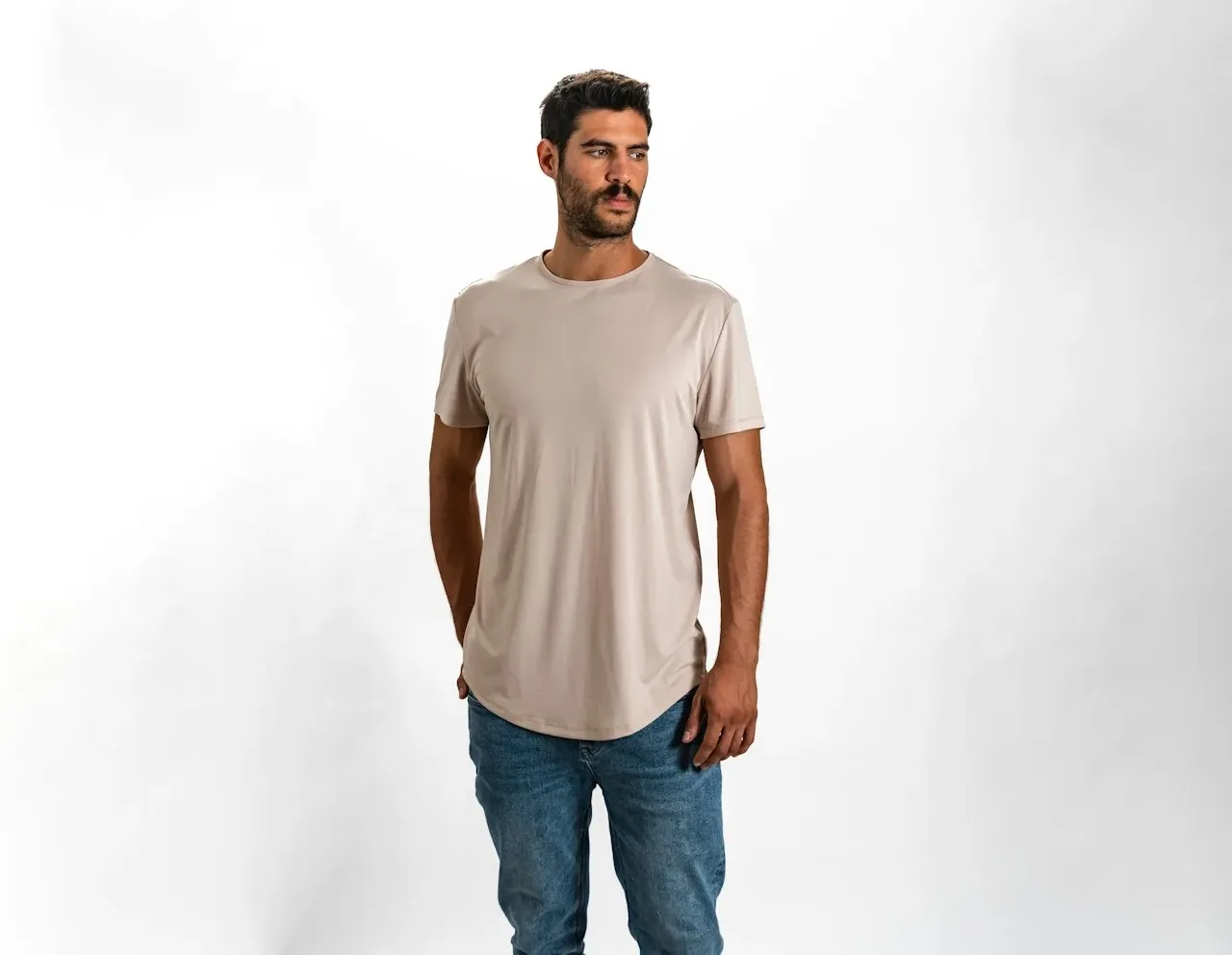 a man standing in a white shirt